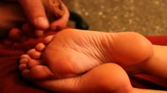 Huge load of cum over sexy feet soles