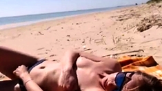 Girl masturbating by the sea